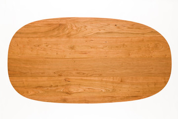 Oval handmade cherry wooden table, natural texture background