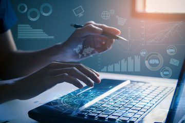 The Typing on laptop close-up.Hand pointing  and working on computer with digital display data