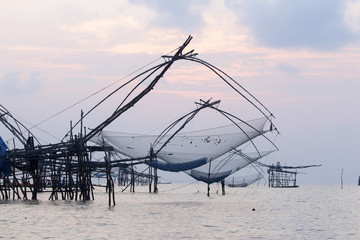 Fisherman work with his net in the early morning.