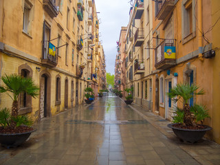 Barcelona, Spain - April 11, 2018: Street in the neighborhood of Barceloneta a day of heavy rain