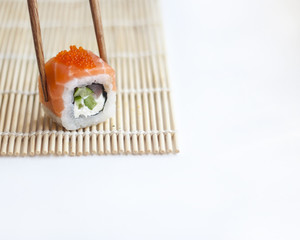 isolated roll philadelphia with tuna in sticks on white background