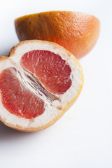 grapefruit halves on white background