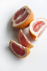 Fototapeta na wymiar slices of grapefruit on white background