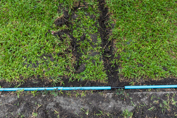 installation of electric wire or cable on ground, blue plastic pipe for underground electrical...
