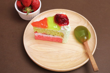 Piece of cake and strawberry kiwi jam topping