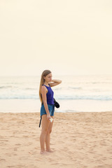 Fototapeta na wymiar woman is standing on the beach