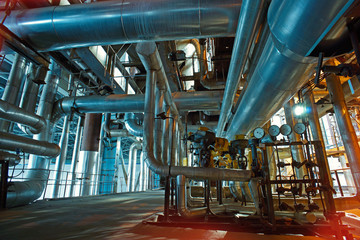 Equipment, cables and piping as found inside of a modern industrial power plant
