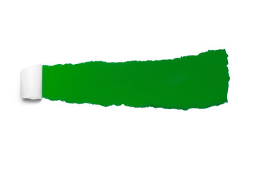 Hole in white paper with torn sides over green paper background with space for text. Torn paper for web advertising