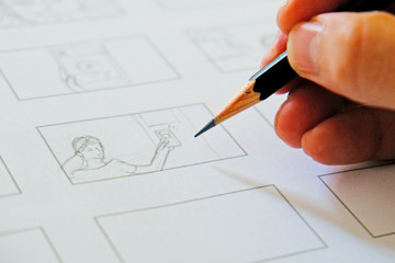 close-up hand drawing storyboard