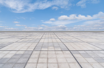 Empty square floor tiles and beautiful sky landscape
