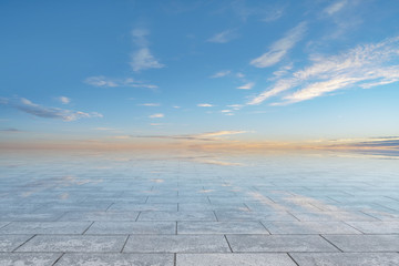 Fototapeta na wymiar Empty square floor tiles and beautiful sky landscape