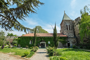 Fototapeta na wymiar Belgrade, Serbia April 24, 2018: Ruzica Church in Kalemegdan fortress, hole building is covered with clambering plant. 