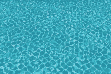 Fototapeta na wymiar Clear blue rippled swimming pool or sea.