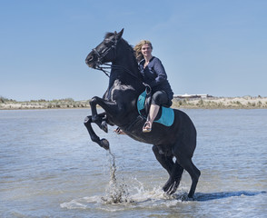 riding woman on the beach