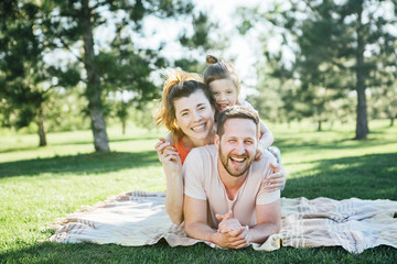 Fototapeta premium Happy family rest in park.