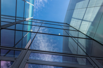 The glass architecture in city against a sky
