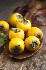 Fresh persimmon on desk