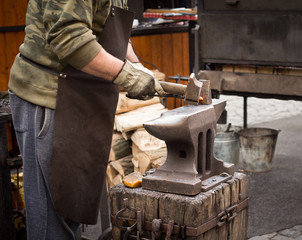blacksmith working with anvil