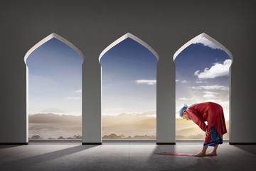 Elderly asian muslim man praying