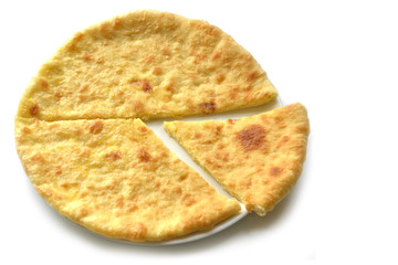 Ossetian pie with stuffing. Homemade pie on a white background