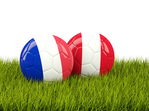 France vs Peru. Soccer concept. Footballs with flags on green grass