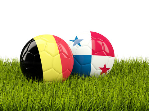 Belgium vs Panama. Soccer concept. Footballs with flags on green grass