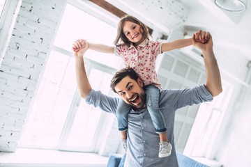 Dad with daughter at home