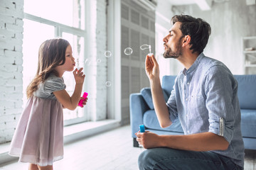 Dad with daughter at home