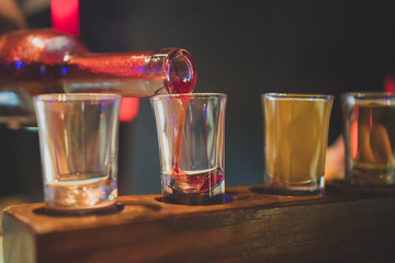 Shot glasses with liquor in the bar.