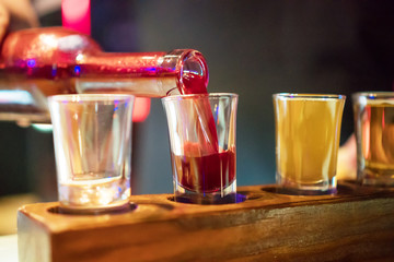 Shot glasses with liquor in the bar.