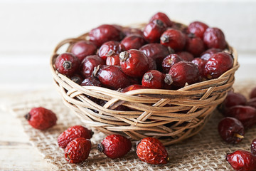 Dried dog rose fruit (Rosa canina) in woven basket