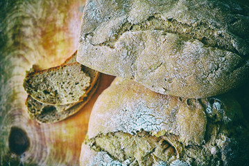 Loaf of homemade freshly baked bread on vintage surface