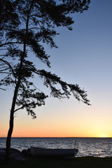 Fototapeta na wymiar Colorful sunset by seaside