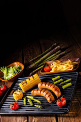 grilled krakauer with french fries and green salad