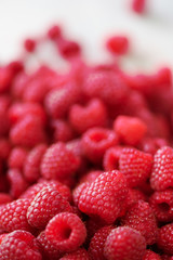 Ripe raspberries macro. Selective focus. Fruit background with copy space. Summer and berries harvest concept. Vegan, vegetarian, raw food.