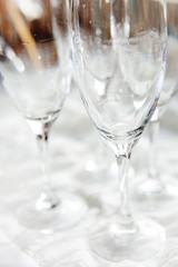 Wet transparent drinking glasses, clear wineglasses after washing.