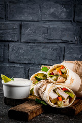 Healthy lunch snack. Stack of mexican street food fajita tortilla wraps with grilled buffalo...