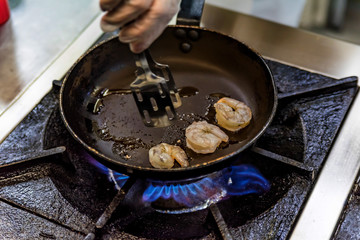 Prawns on frying pan. Cooking concept