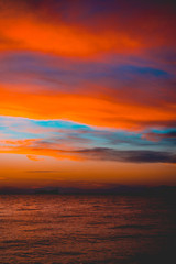 Fototapeta premium Dramatic bright vivid orange marine sunset