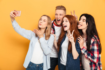 Group of happy school friends taking a selfie