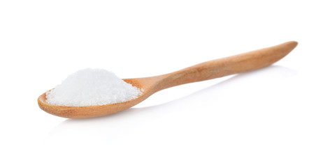 Salt in wooden spoon on white background