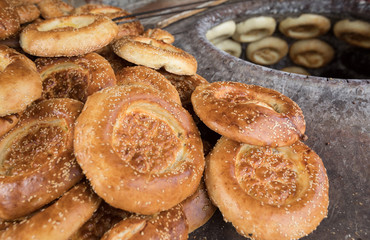 baking naan flat breads in the tradional clay oven,xinjiang,china