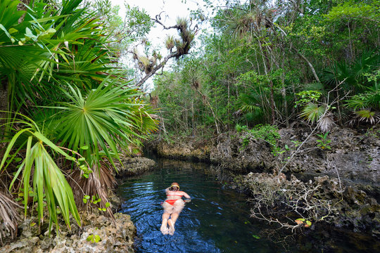 Diving tourist in Cueva de los Peces it is a 70m-deep cenote on the south coast of Cuba  near Giron beach