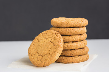 Healthy Food Snack Concept. Stack of oatmeal cookies. Homemade gingerbread on table.