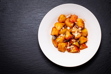 food concept Fried Red organic Apple chopped with cinnamon,sugar and butter in the white dish