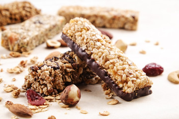 Top view of various healthy granola bars (muesli or cereal bars). Set of energy, sport, breakfast and protein bars isolated on white background