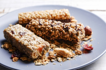 Top view of various healthy granola bars (muesli or cereal bars). Set of energy, sport, breakfast and protein bars isolated on white background