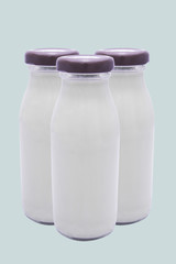 Bottle of milk isolated on blue background and texture