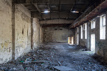 Fototapeta na wymiar Inside abandoned factory, big space