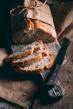 Rustic bread loaf on dark background